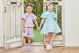 【左】 <br>11-304 サッカーギンガムセーラーブラウス <br>(クロ/★パープル) <br>・BABY￥14,080-(90cm) <br>・TODDLER ￥15,180～(100cm～140cm) <br>・SISTER ￥17,380-(150cm/160cm) <br>11-309 サッカーギンガムショートパンツ <br>(クロ/★パープル) <br>・BABY￥11,880-(90cm) <br>・TODDLER ￥12,980～(100cm～140cm) <br>・SISTER ￥15,180-(150cm/160cm) <br>11-325・326・327 ダブルリボンスポーツサンダル <br>(オフ白/クロ/★パープル)￥12,980～(17～24cm) <br><br>【右】 <br>11-317 サッカーギンガムリボンワンピース <br>(キイロ/★サックス)￥15,180～(100cm～140cm) <br>11-325・326・327 ダブルリボンスポーツサンダル <br>(★オフ白/クロ/パープル)￥12,980～(17～24cm)